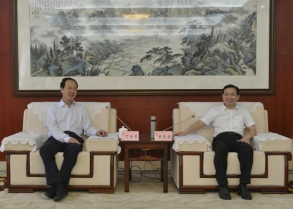 丁焰章拜會南昌市委副書記、市長黃喜忠